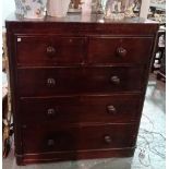 A Victorian mahogany chest of two short and three long graduated drawers with turned handles and