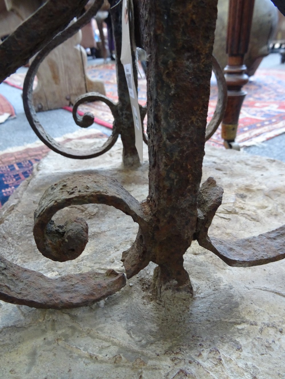 An early 19th century wrought iron boot scraper, on stone base, 45cm wide. - Image 3 of 5