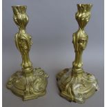 A pair of Louis XV style gilt metal candlesticks (converted), 24cm high,
