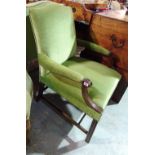 A pair of George III style mahogany open armchairs on block supports with green upholstery,