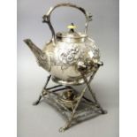 A Victorian silver plated tea kettle, of spherical form, with floral and scroll embossed decoration,