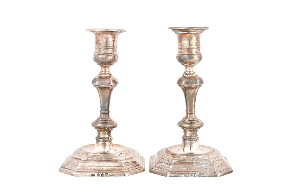 A pair of Victorian Britannia Standard silver table candlesticks, each with a knopped stem,