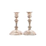 A pair of Victorian Britannia Standard silver table candlesticks, each with a knopped stem,