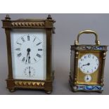 A Victorian brass cased carriage clock of gothic form with a single train movement and subsidiary