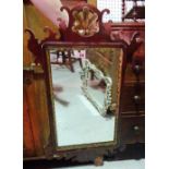 A George III style mahogany, parcel gilt and fret work mirror, 52cm wide x 84cm high.