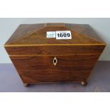 A Regency rosewood sarcophagus tea caddy on gilt ball supports, 20cm wide x 15cm high x 12cm deep.