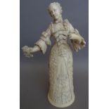 A Dieppe carved ivory figural triptych, 19th century, modelled as a lady wearing a ball gown,