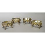 Two pairs of silver gilt salts, each of oval form,