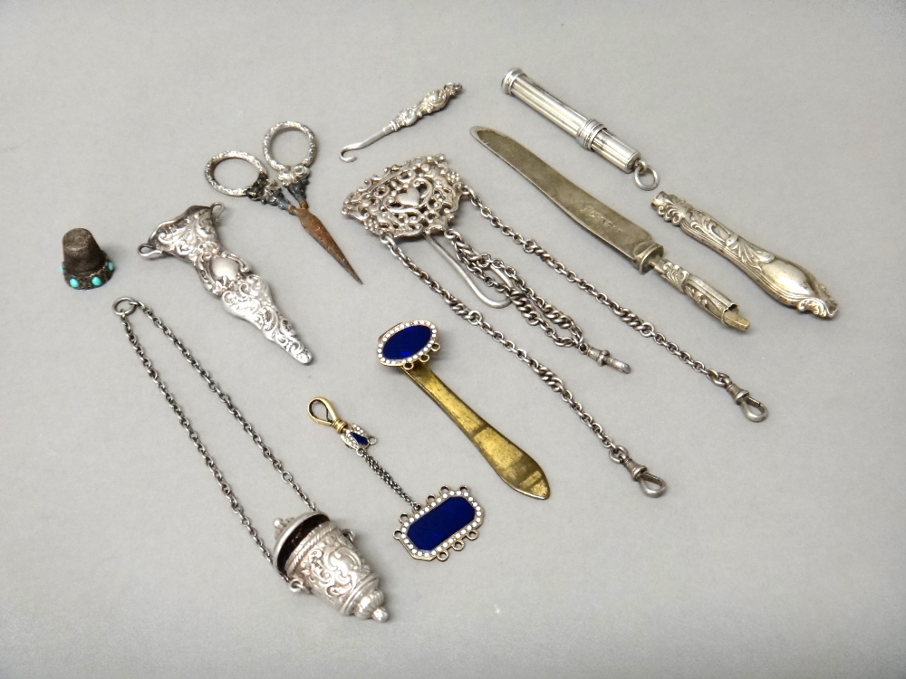 A late Victorian silver chatelaine clip, fitted with three swivels to the pendant chains,