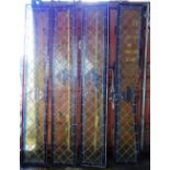 Four Circa 1900 rectangular leaded stained glass panels with yellow, blue and red glass,