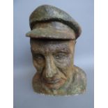 A Belgian painted terracotta bust of a fisherman, by Martine Labbeke (b.1953), incised 'M.