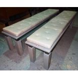 A pair of 20th century blue painted hardwood rectangular benches, on block supports,