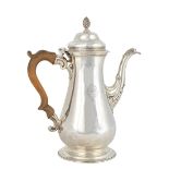 An early George III silver coffee pot, of baluster form, the hinged lid with a wrythen knop finial,