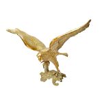 A large cast brass finial moulded as an eagle with outstretched wings, 97cm wide x 72cm high.