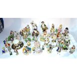 A large quantity of mainly early 20th century continental porcelain figures.