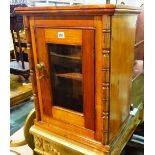 A 20th century mahogany hanging display cabinet with turned column decoration,