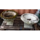 A matched pair of early 20th century reconstituted stone garden urns with egg and dart decoration,