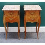 A pair of gilt metal mounted marquetry inlaid kingwood bedside tables each with marble top over