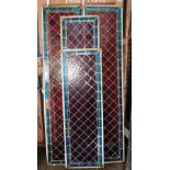 Four Circa 1900 red and blue stained glass leaded windows, two measure 45cm wide x 215cm long,