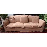 Conran; a 20th century sofa with loose tan cotton covers, 225cm wide x 85cm high.