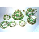 A Victorian green floral and gilt decorated tea set.