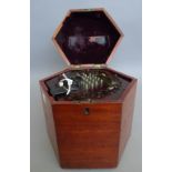 A 19th century rosewood and leather bound squeeze box or concertina, of hexagonal form,