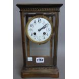 A French brass four glass mantel clock, early 20th century,