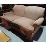 A 20th century oak framed two seater sofa, with brown upholstery, 185cm wide.