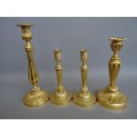 A pair of Louis XVI style French ormolu candlesticks,