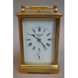 A French brass cased grande sonnerie carriage clock, late 19th century (later enamel dial),