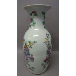 A Chinese famille-rose baluster vase, 20th century, painted each side with vases of flowers,