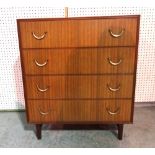 A 20th century teak chest of four long drawers on tapering supports, 76cm wide x 86cm high.