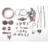 Mostly silver jewellery, comprising; a charm bracelet,