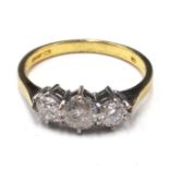 An 18ct gold and diamond set three stone ring,