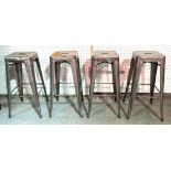 A set of four 20th century metal bar stools on tapering supports, each 76cm tall.
