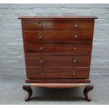 An early 20th century Anglo Indian hardwood desk of five long graduated drawers,