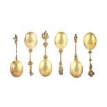 Six silver gilt dessert serving spoons, each with an oval bowl,