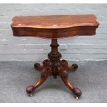 A Victorian figured walnut pedestal card table,