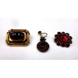 A faceted and flat cut garnet set brooch, circa 1830, a Victorian shaped rectangular brooch,