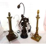 A gilt metal corinthium column shaped lamp, 40cm high another similar and a spelter figural lamp,