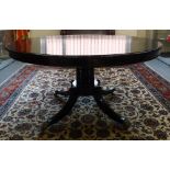 A George III and later ebonised centre table,