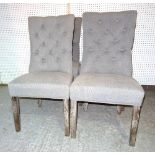 A set of four 20th century limed oak dining chairs with grey button back upholstery, (4).