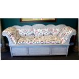 A 19th century and later painted Swedish sofa with rollover ends,