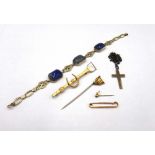 A blue stained chalcedony panel link bracelet, on a boltring clasp, a gold pendant cross,