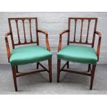 A pair of George III mahogany carver chairs, with bow seats on tapering square supports,