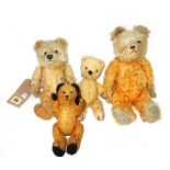 A group of four early 20th Century teddy bears.