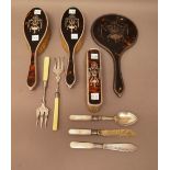 A lady's silver and tortoiseshell mounted four piece part dressing set, comprising; a hand mirror,