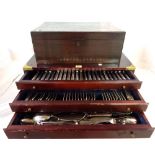 A 20th century silver plated flatware set cased in a mahogany brass bound three drawer canteen,