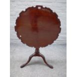 An 18th century mahogany occasional table, the pie crust snap top on carved tripod base,