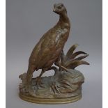 After Moigniez; a patinated French bronze model of a game bird, late 19th century,